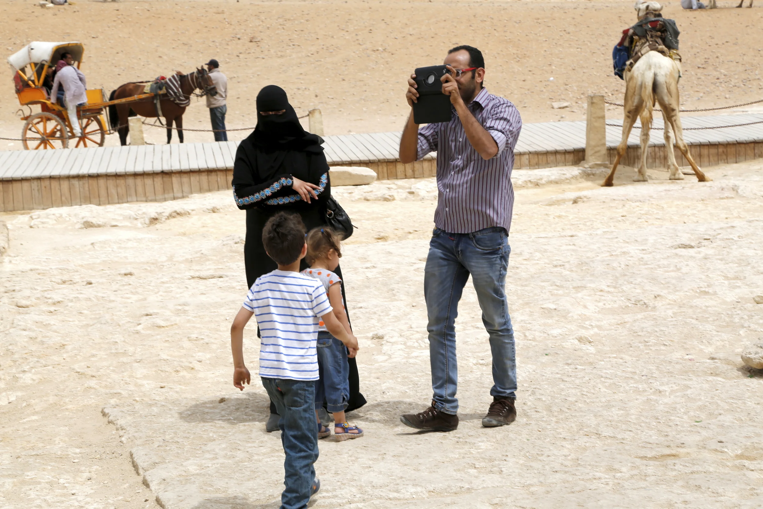  Tourists next to the Great Pyramid of Giza. 