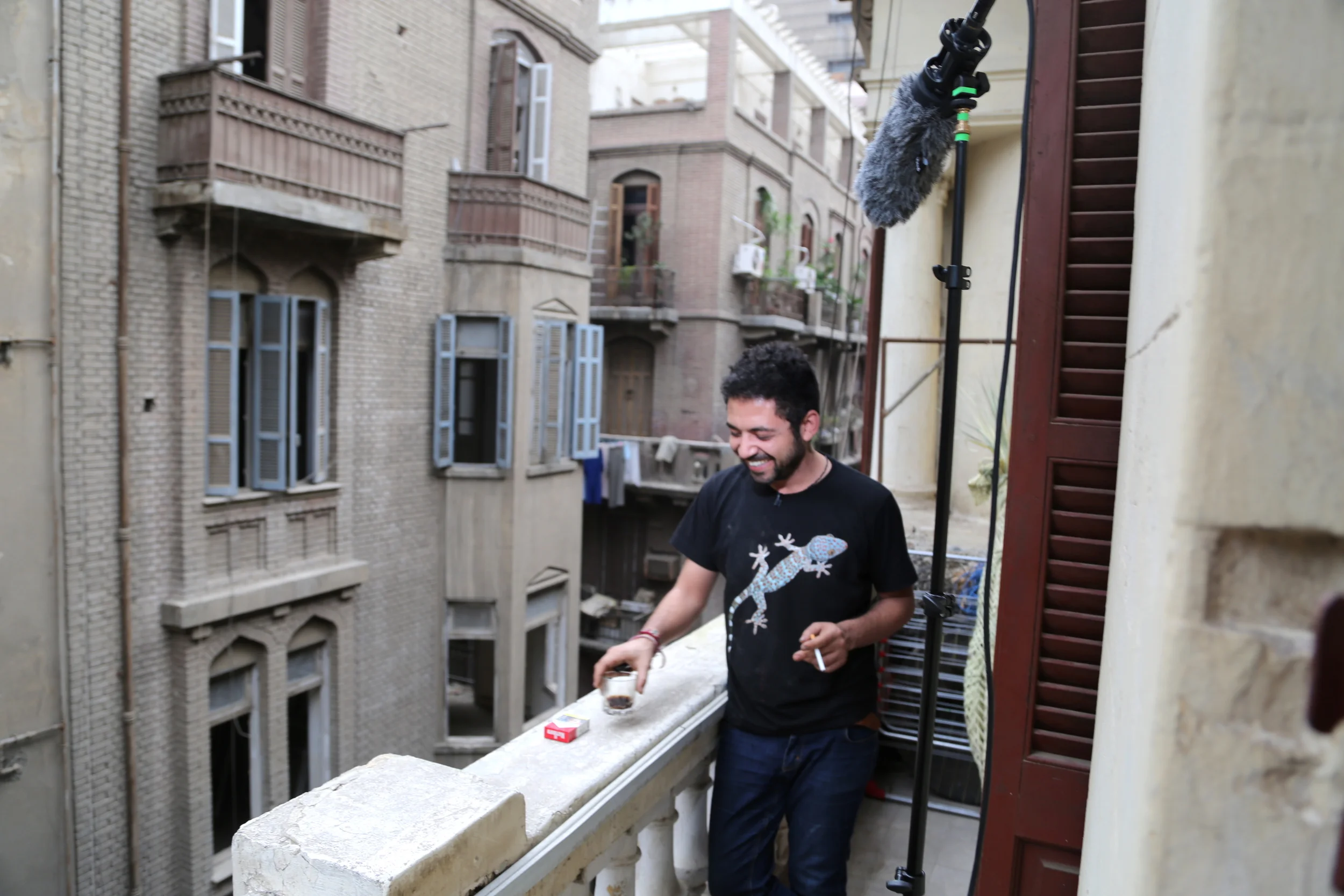  Artist&nbsp; Ammar Abo Bakr &nbsp;on the balcony of his Cairo studio/apartment during a break in&nbsp;his interview. 