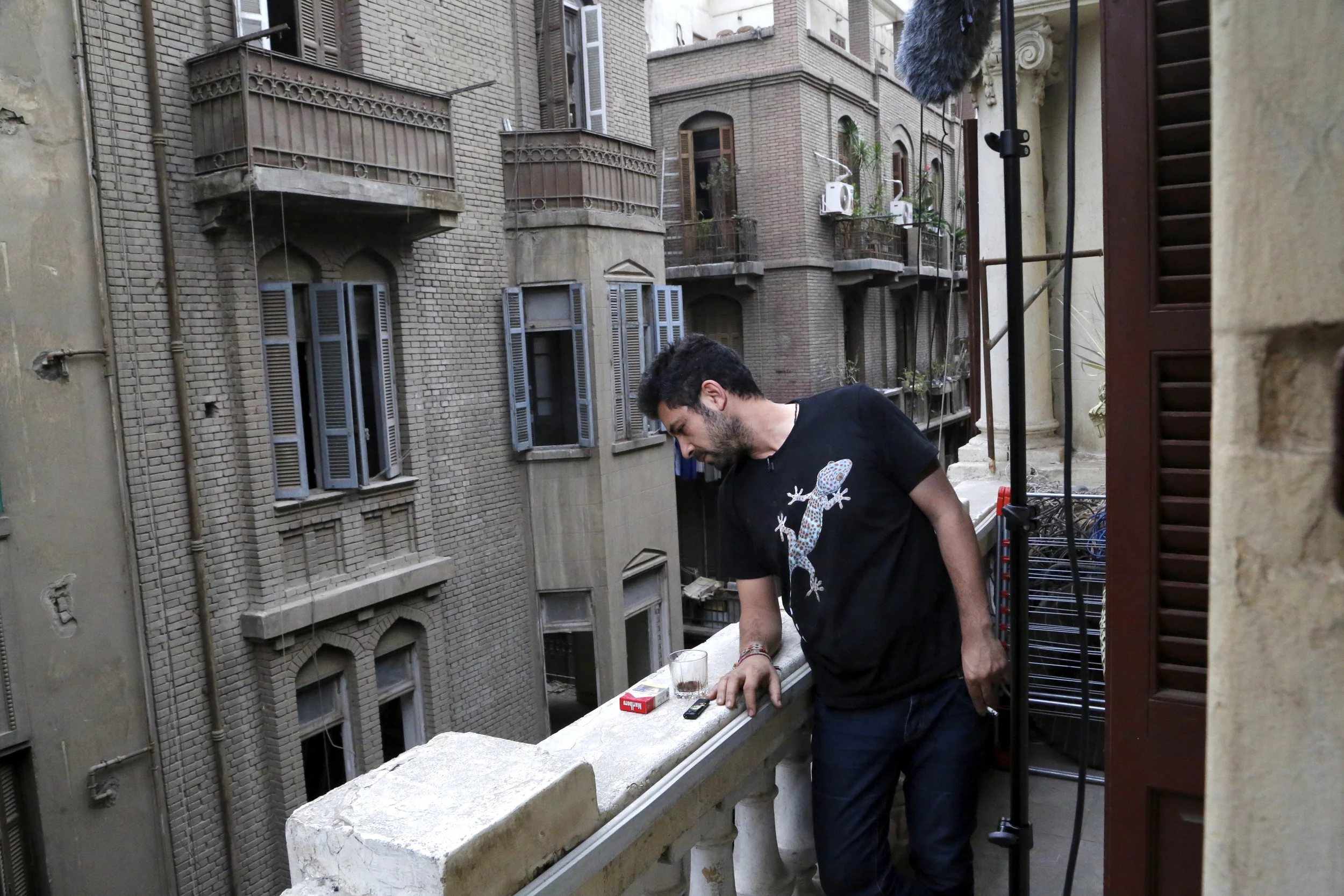  Artist&nbsp; Ammar Abo Bakr &nbsp;on the balcony of his Cairo studio/apartment during a break in&nbsp;his interview. 