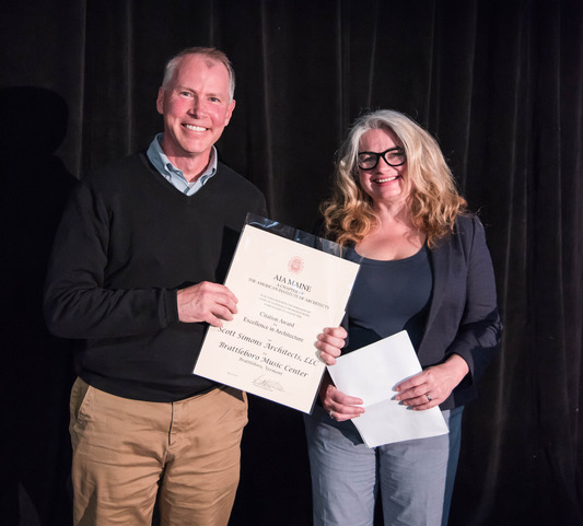 Austin Smith of Scott Simons Architects accepts the award for the Brattleboro Music Center.