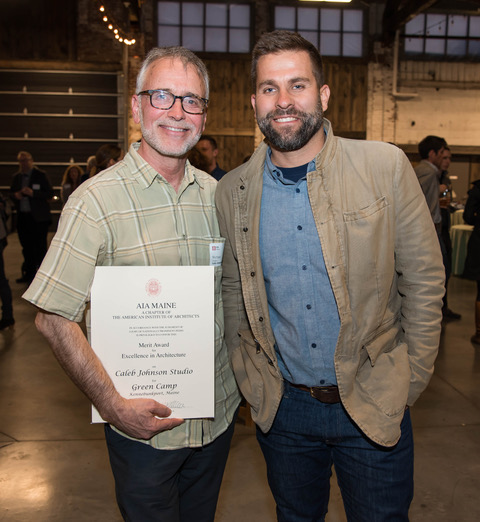 Michael Chestnutt and Caleb Johnson both of Caleb Johnson Studio with their award for Green Camp.