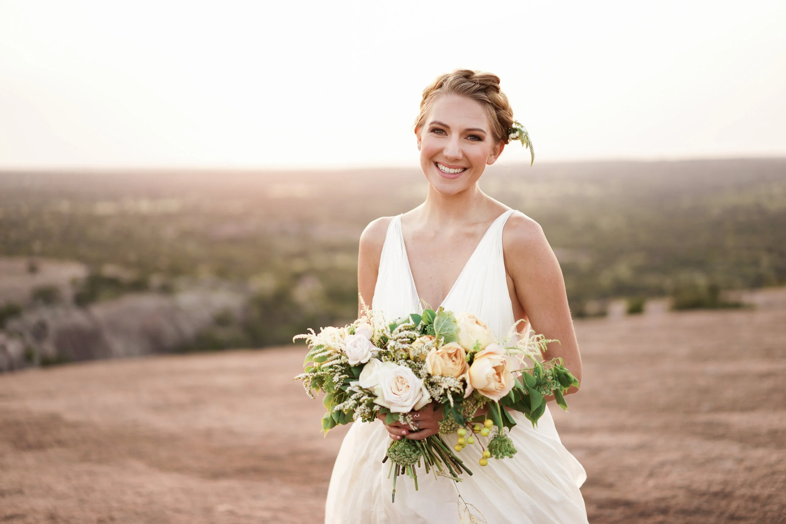 such a genuine smile and a beautiful bouquet by Austin florist clementine atx