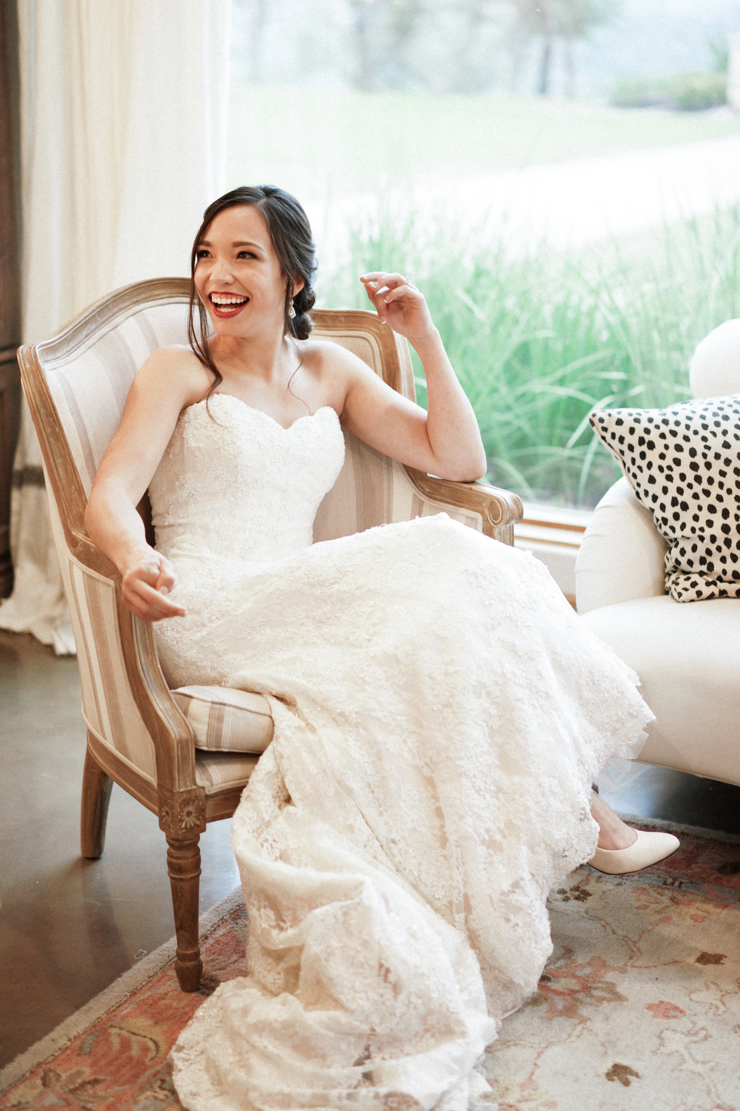 What a joyful bride in the beautiful bridal suite at Canyonwood Ridge!
