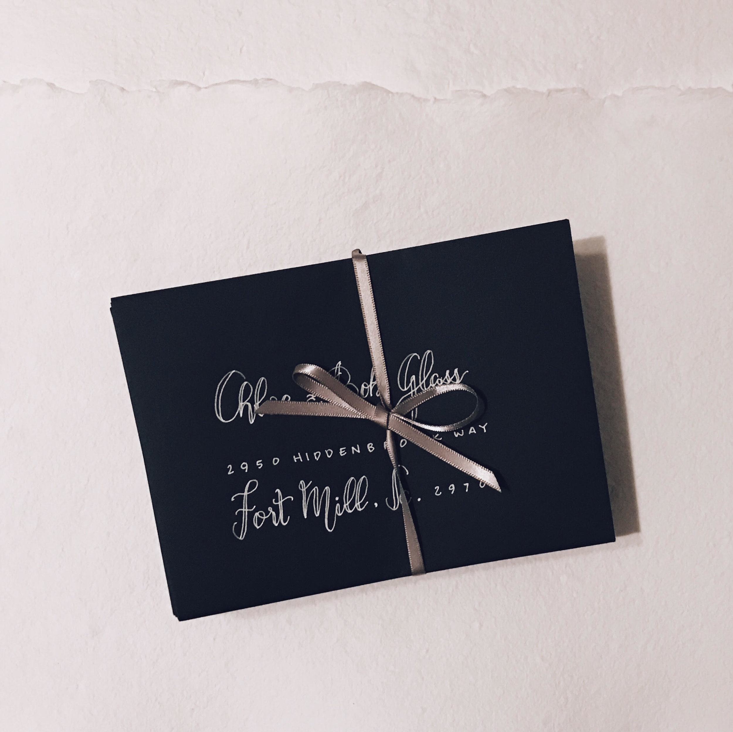 "We were in desperate need of envelopes for our wedding invites ASAP. After deciding against getting the addresses printed on the envelopes by some big run-of-the-mill printing company, we looked for someone local who could handwrite the addresses in a calligraphy style. When I found Patricia, she was super responsive and was quick to help meet my needs! She turned the project around in no time and even personally delivered them to my door. The envelopes came out beautifully and they were exactly what we were hoping for. The helpfulness (bc we didn't know exactly what we wanted!), efficiency, fair pricing, and more definitely leads me to recommend Patricia to anyone with similar needs!" - Ross Bucherati