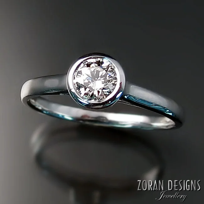 Modern, diamond solitaire engagement ring