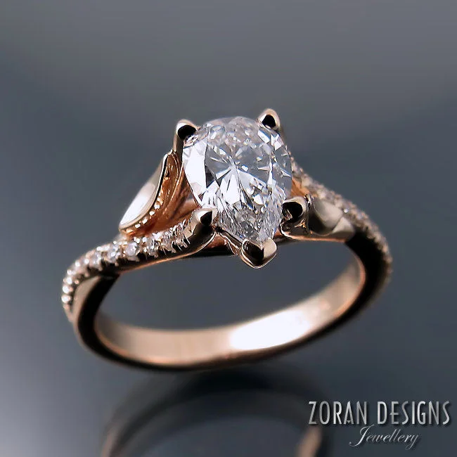 Leaf design engagement ring: rose gold with a pear cut centre