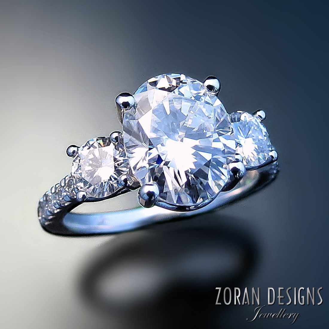 Three Stone Engagement Ring With Sapphire Side Stones