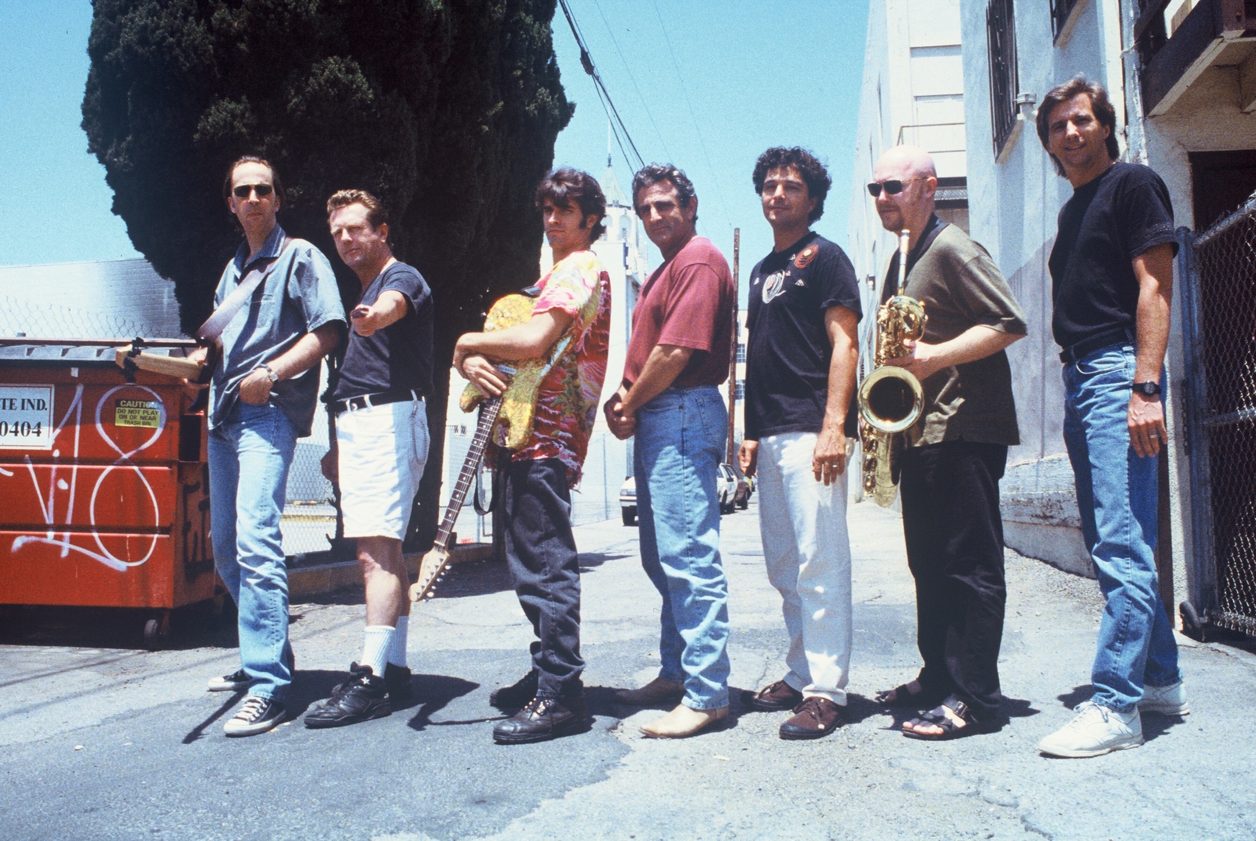 from left to right: Fer Bos (bass), the late John “Juke” Logan (harmonica), Russ Parrish (guitar), John Herzfeld (director), Anthony Marinelli (composer), Brandon Fields (saxophone) and Mark Curry (engineer)