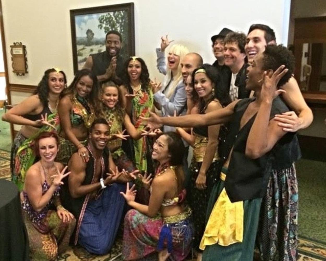 Singer/songwriter Sia (center) with BollyDoll creators Amrita Sen and Anthony Marinelli and cast, after their performances at Deepak Chopra’s Sages &amp; Scientists Symposium, Carlsbad, CA (2014)