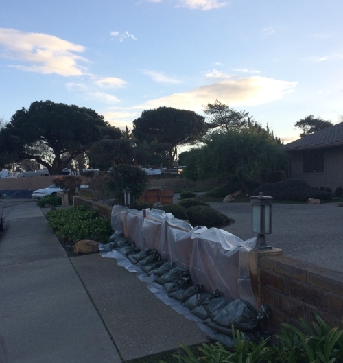 These small walls are not JUST for tripping people running at night--with a slide in gate, tarp, and sandbags, they also double as flood barriers.