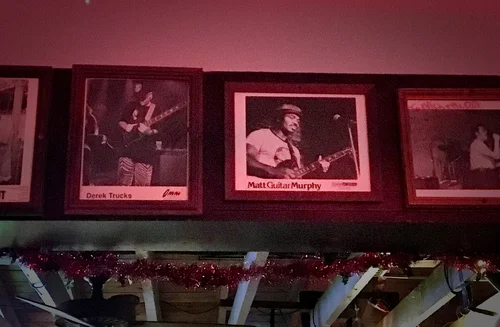 Photographs of bluesmen cover the walls of The Double Door