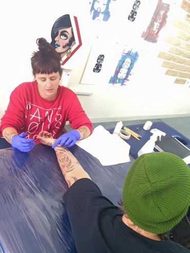Moko artist Sian Montgomery-Neutze putting in work at the space.