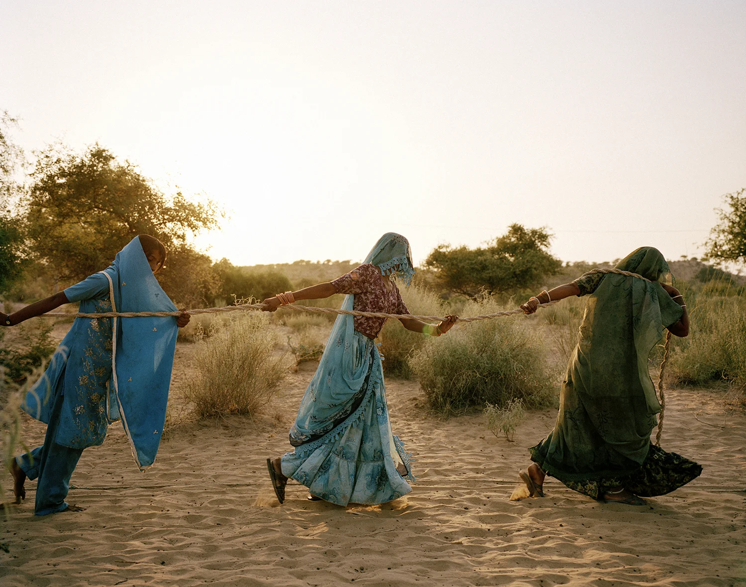Women pull water from a well. Tharpakar, Pakistan, 2013.
