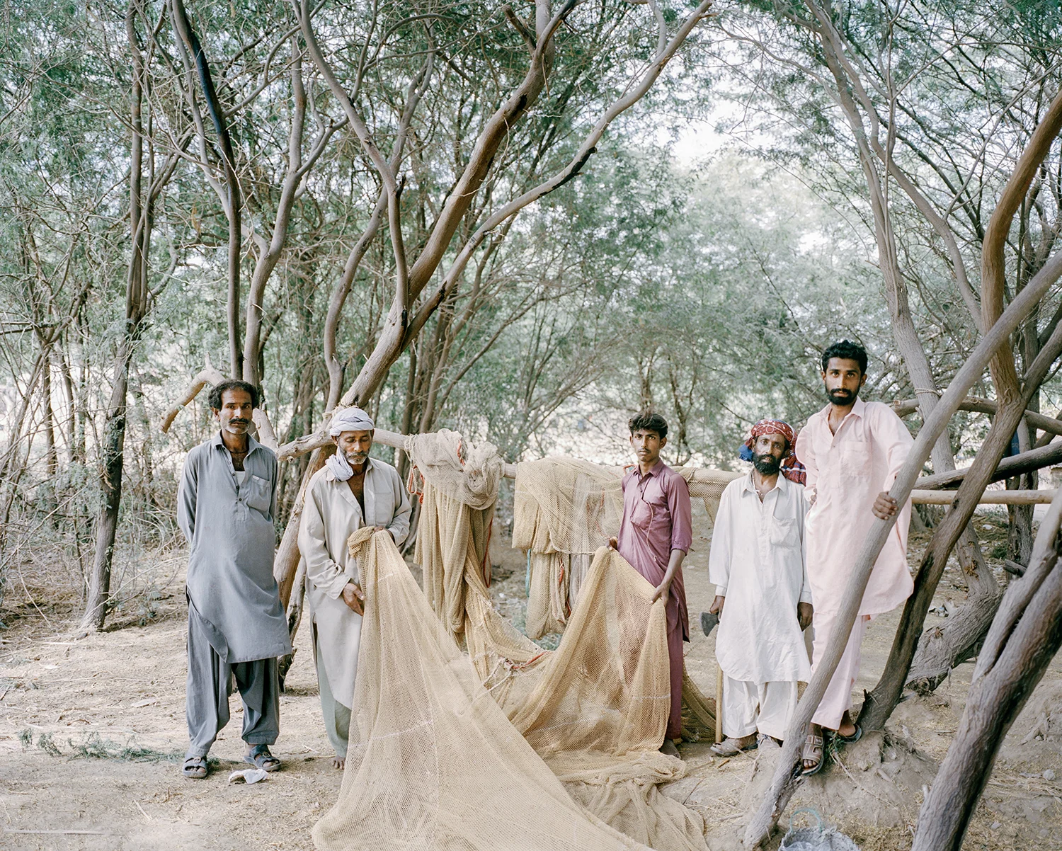 Fishermen wait for their turn to sea. Sindh Province, Pakistan, 2013.