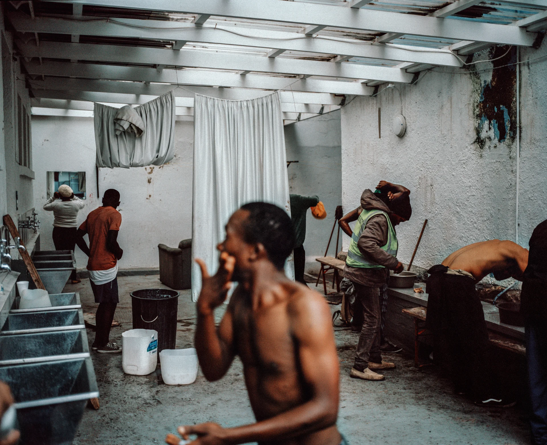 Bathing area for the homeless due to drought restrictions closing down public restrooms. The Carpenter’s Shop, Cape Town, South Africa, 2018.