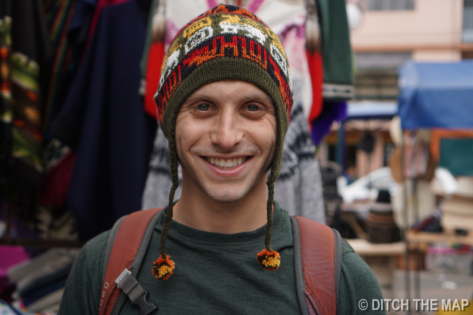 Scott buys an alpaca hat in Otavalo, Ecuador
