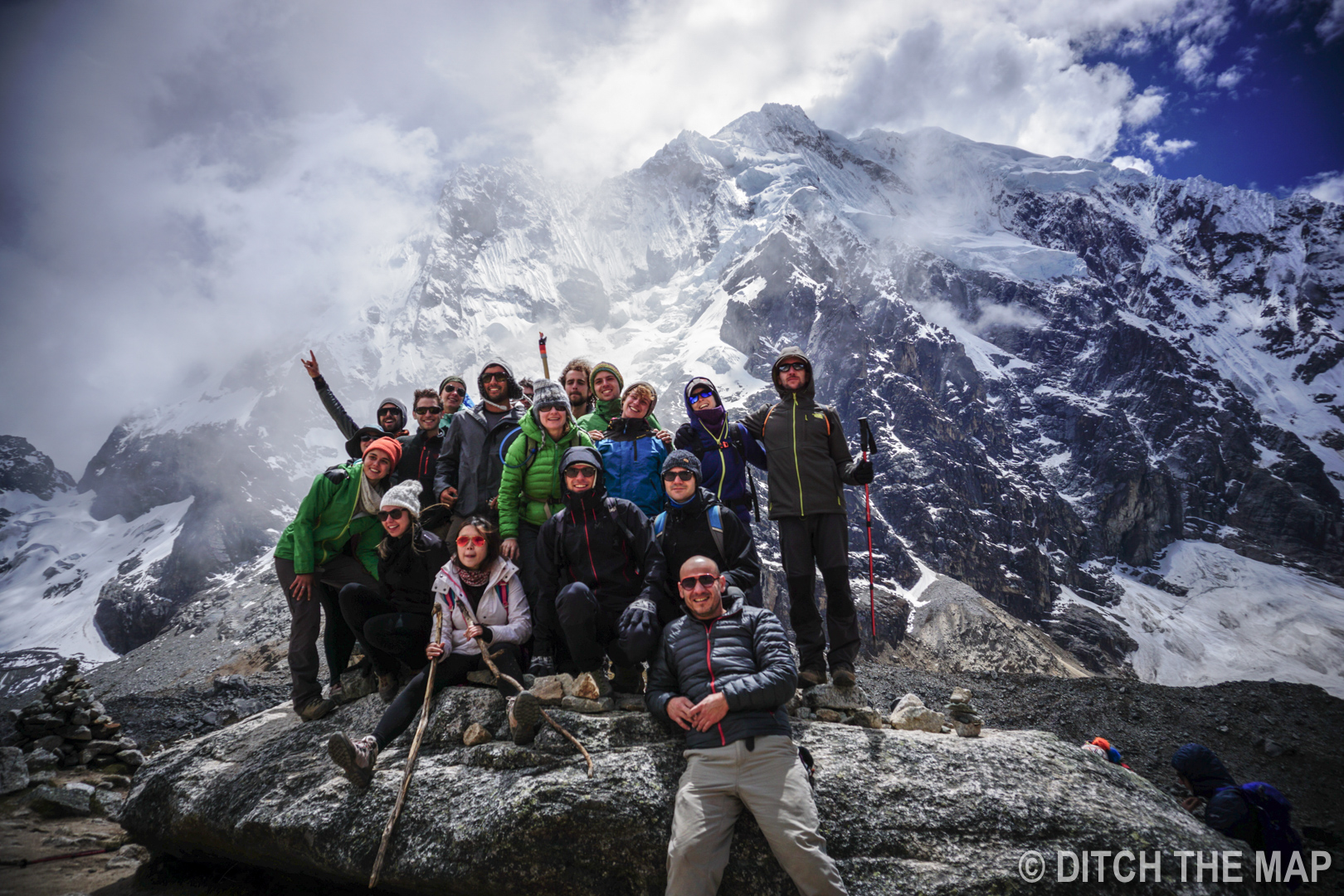 OUR GROUP POSES ABOVE 15K FEET AT THE SALKANTAY MOUNTAIN PASS , PERU