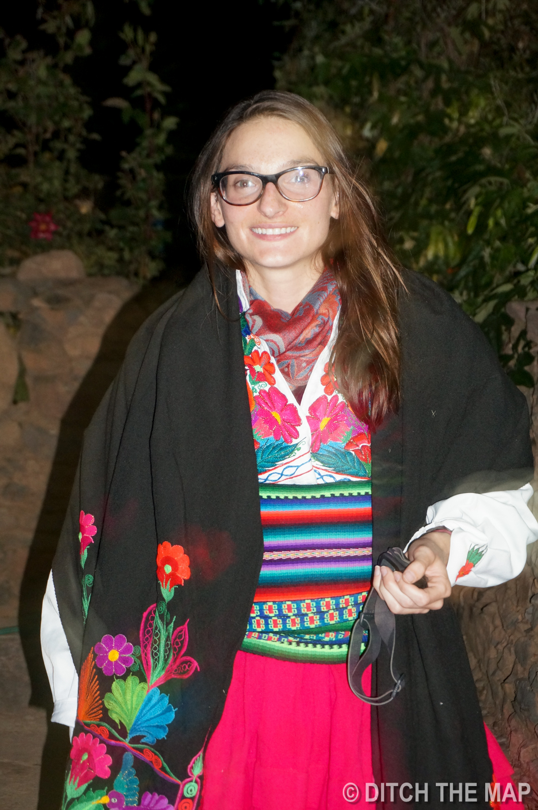 Sylvie dresses up in the local garb on Amantani island in Lake Titicaca, Peru