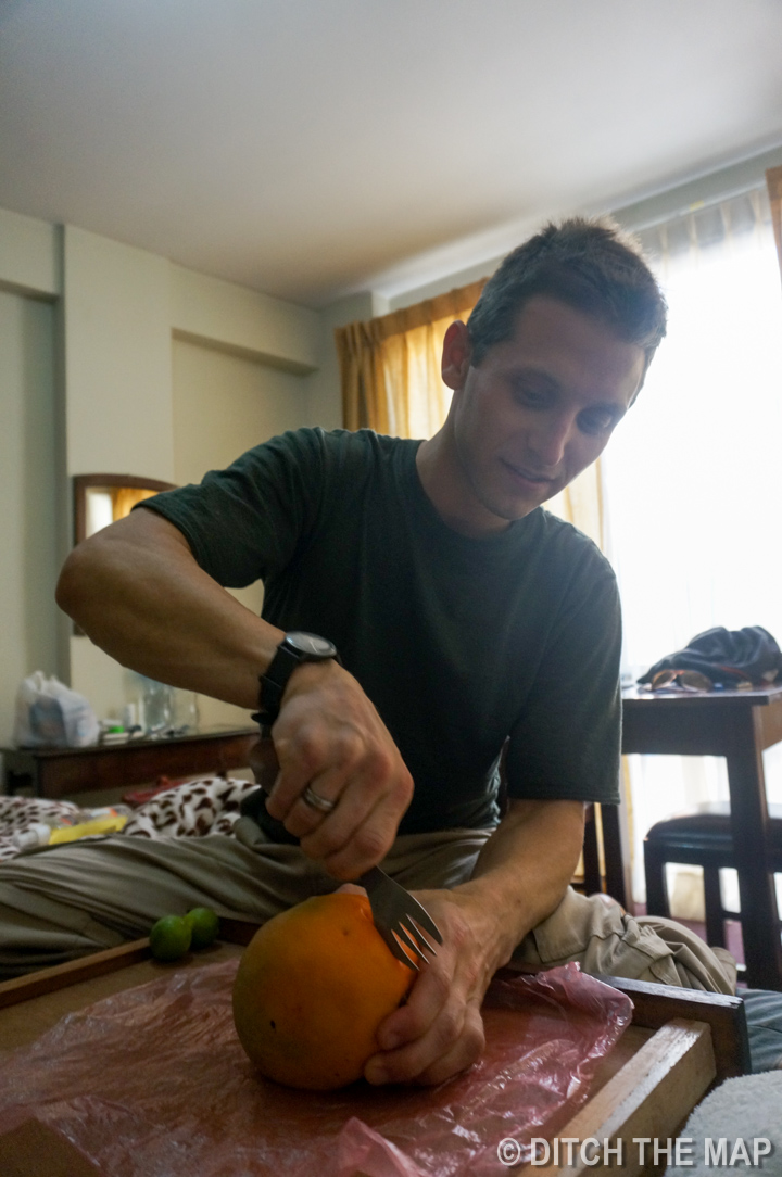 I prepare a mango for Sylvie and me in La Paz, Bolivia