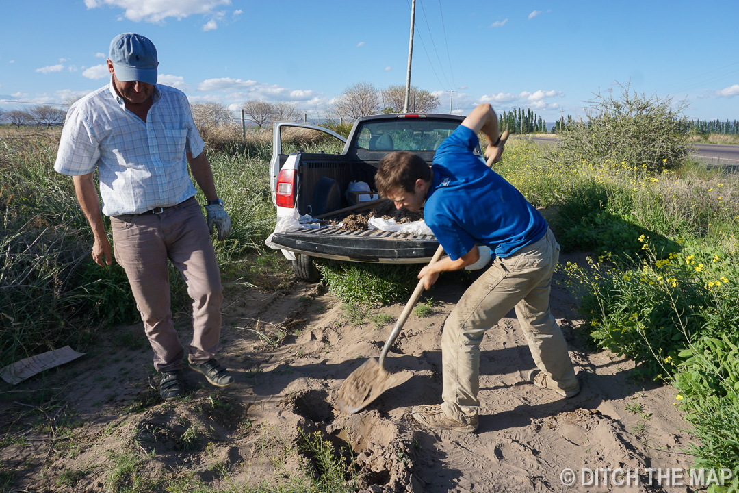Orlando has me dig up organic soil in Tupungato, Argentina