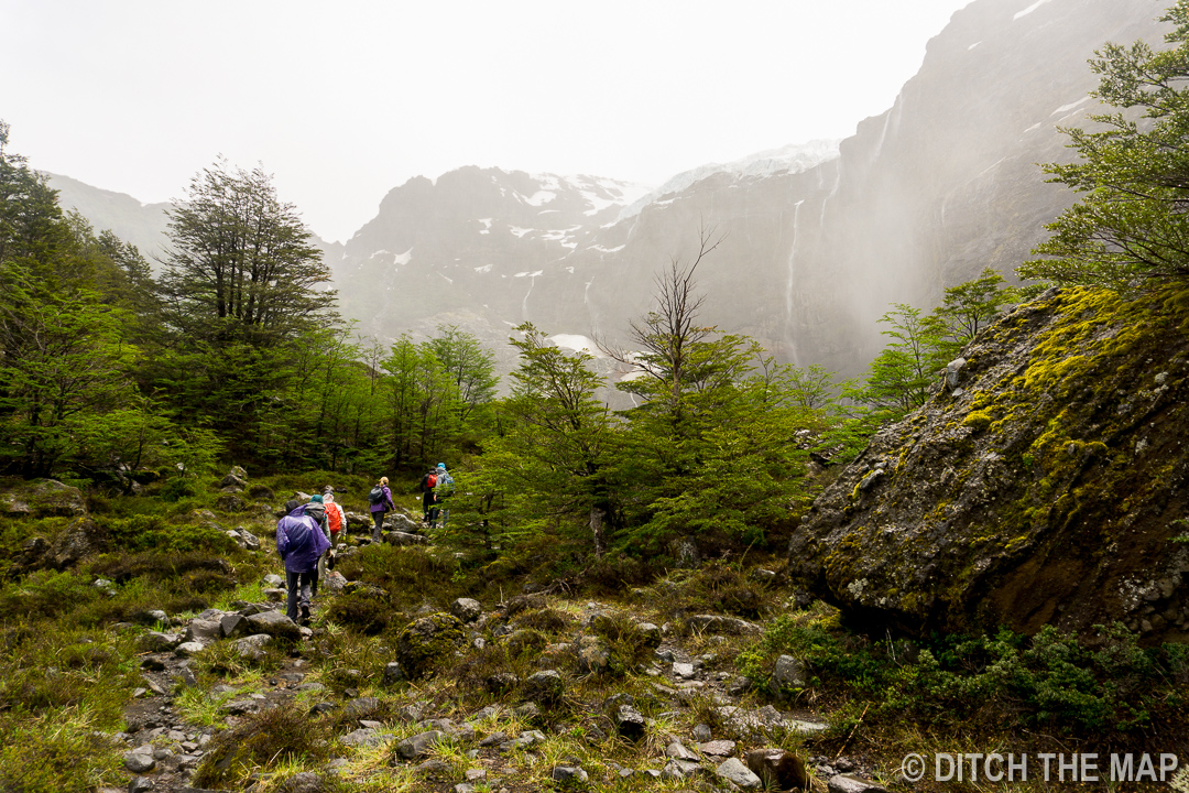 Walking the last stretch of our hike through windy conditions to Alerce Glacier outside Bariloche, Argentina