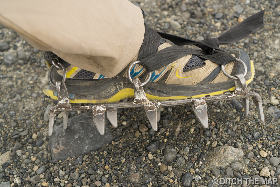 Putting on crampons to trek on Perito Moreno Glacier just outside El Calafate, Argentina