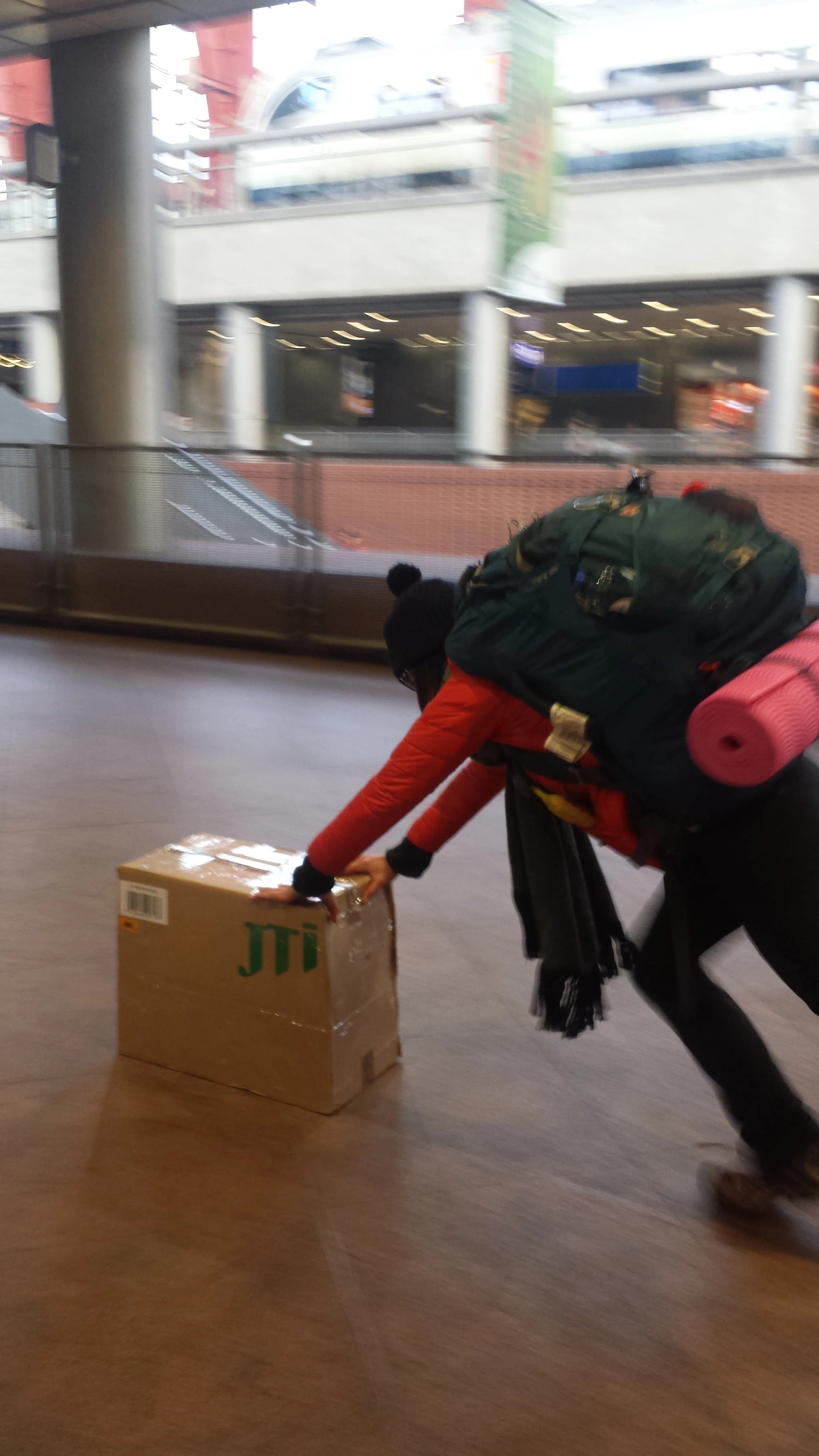 Sylvie helps in moving our large box of beer in Antwerp, Belgium