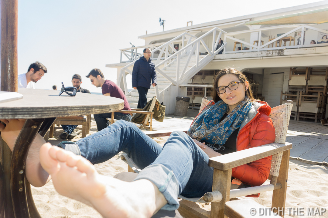 Sylvie enjoys a free foot rub on the Black Sea in Varna, Bulgaria
