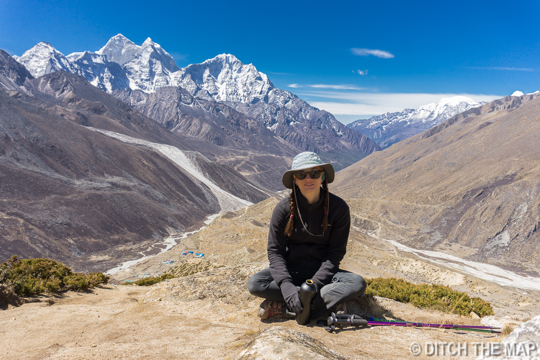 Sylvie rests while hiking up Nagarjun Hill outside of Dingboche