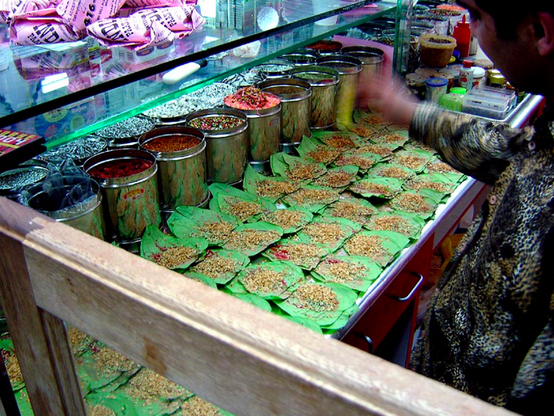 Shopkeep Making Paan at Stall on Street