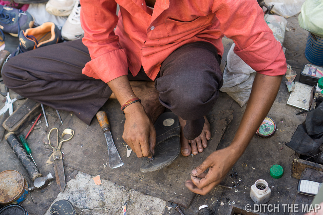 Getting my sandals repaired on the streets of Jodhpur, India