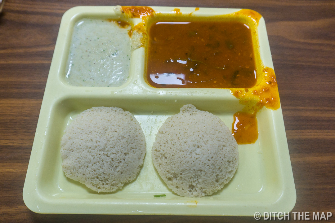 Trying a Southern Indian Dish ' Idli ' at a Train Station in Mumbai