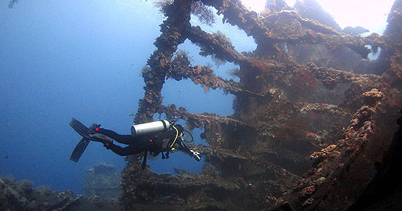 A SCUBA Diver in the Liberty Wreck outside Tulamben, Bali