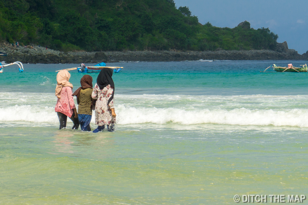 Local Women Swimming at Beach in Lombok, Indonesia