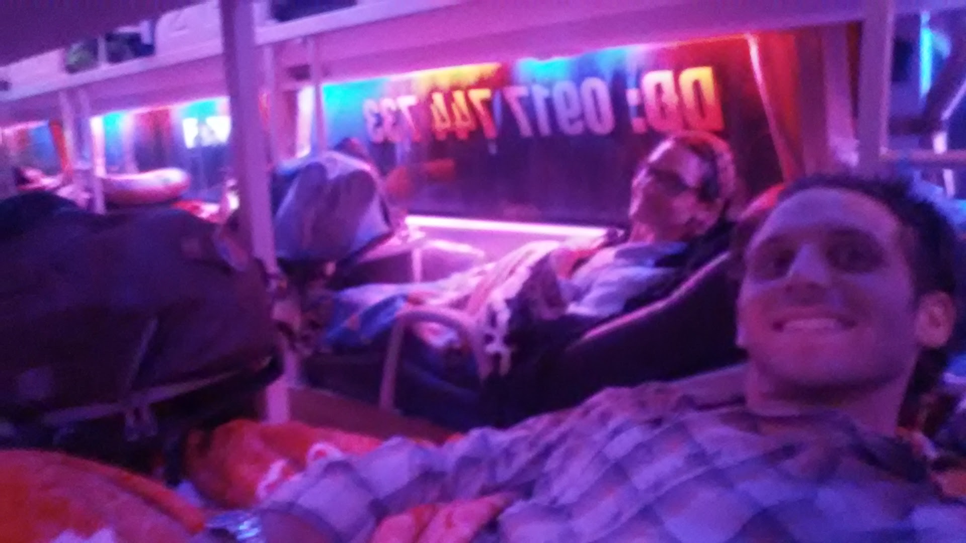 We try to get comfortable on our sleeper bus from ha giang provence to hanoi, vietnam