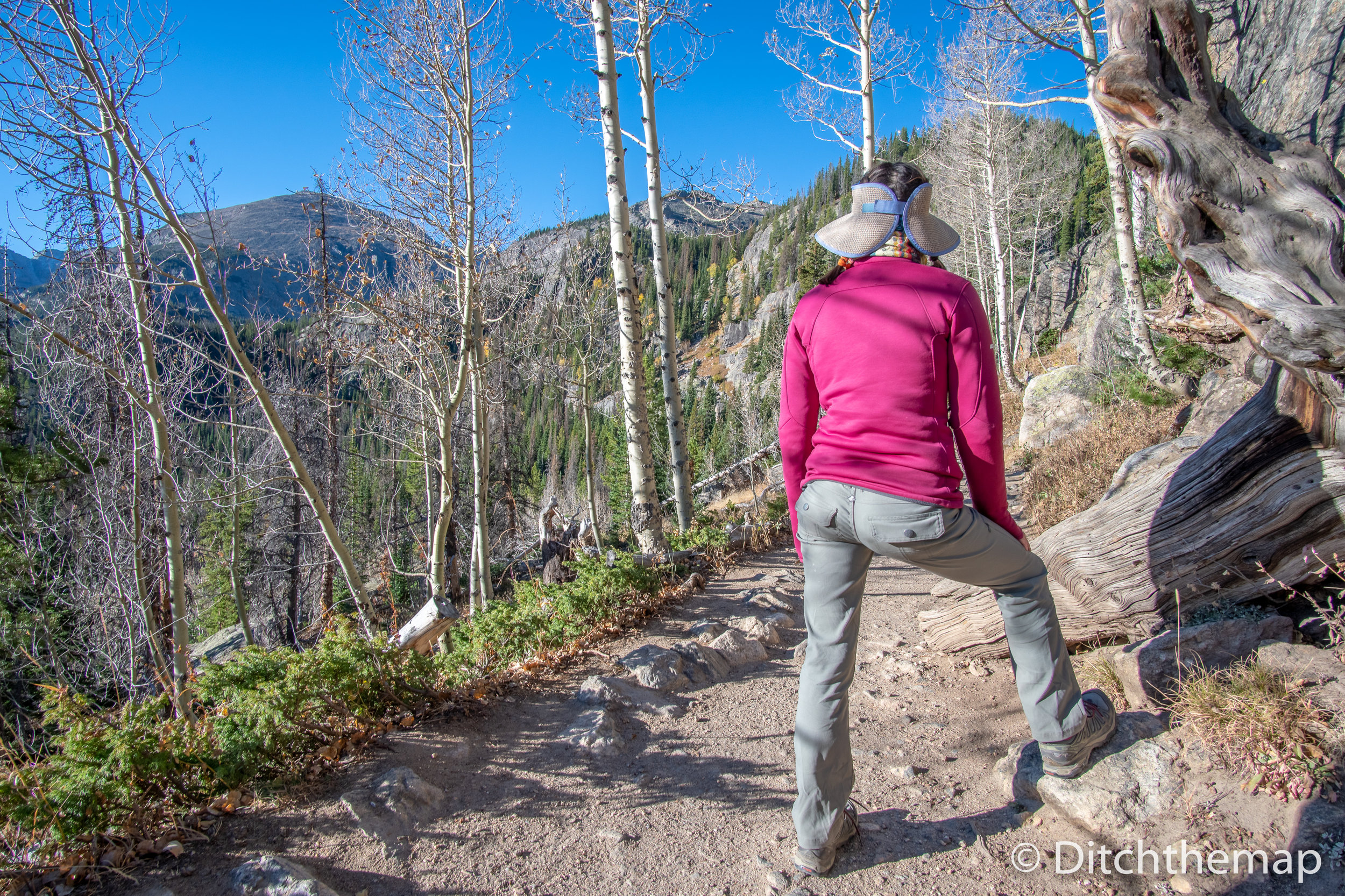 Girl Hiking and taking a look into the Rocky Mountains