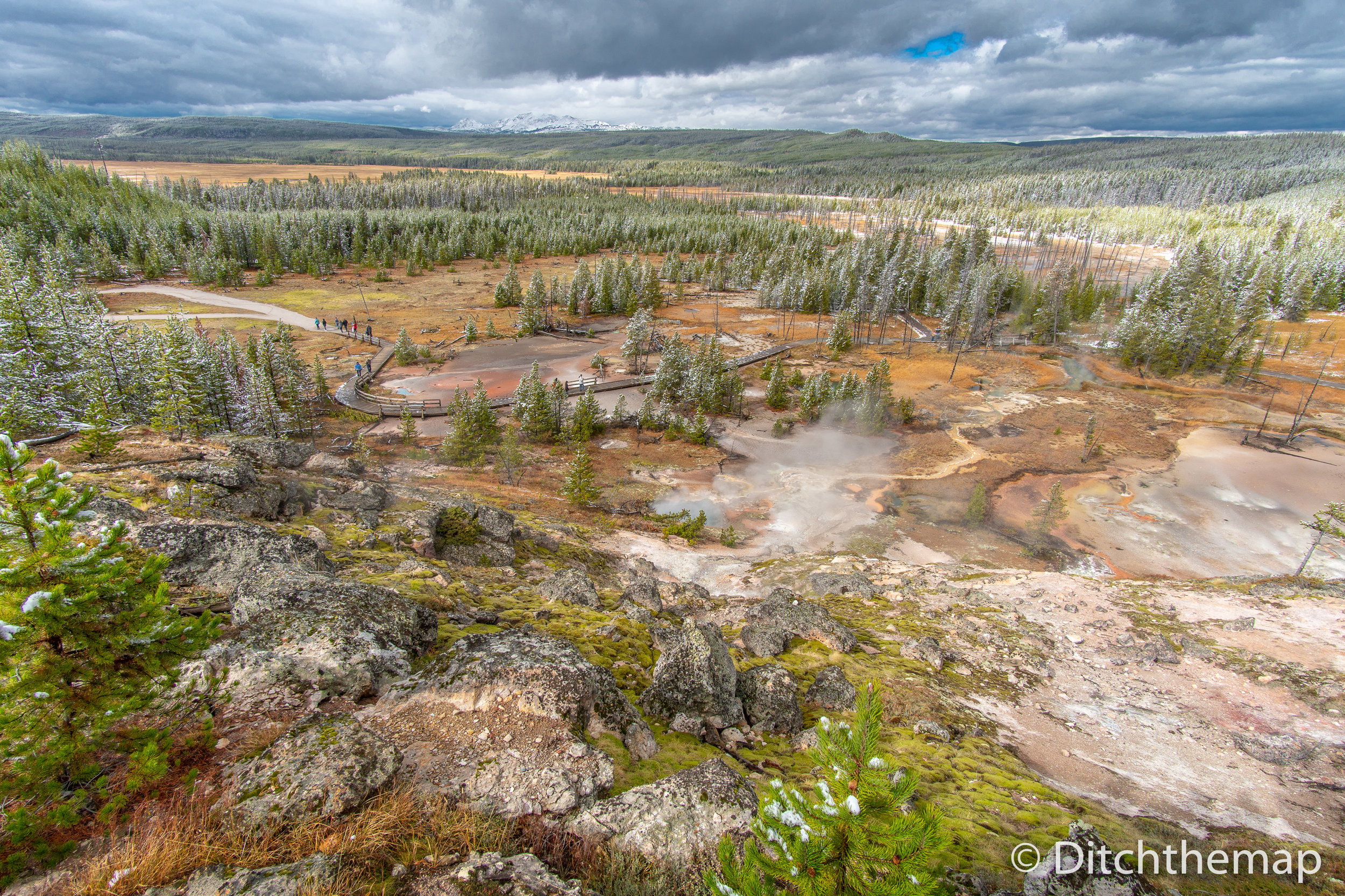 Yellowstone landscape of geiser pools and mud pots