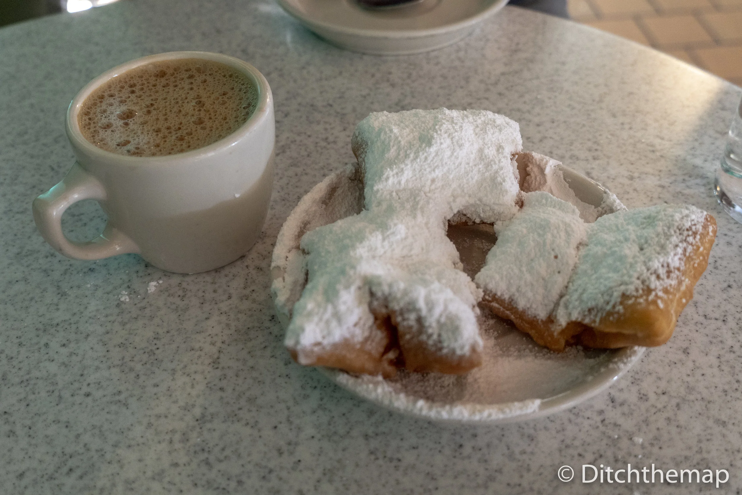 Enjoying Beignets and Cafe Au Lait