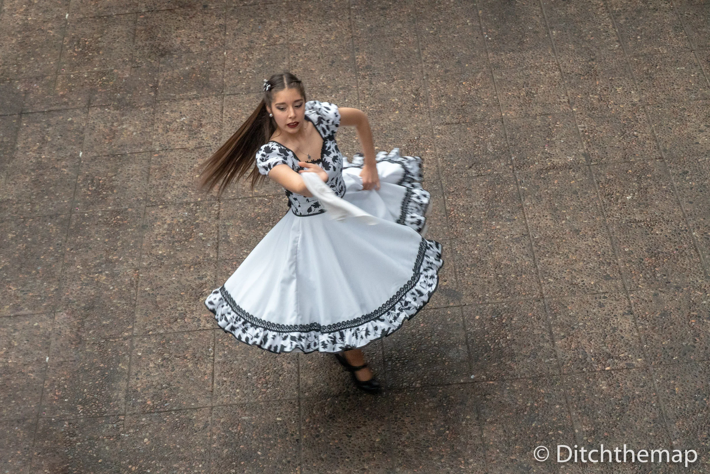 Watching traditional dance at a market in Santiago, Chile