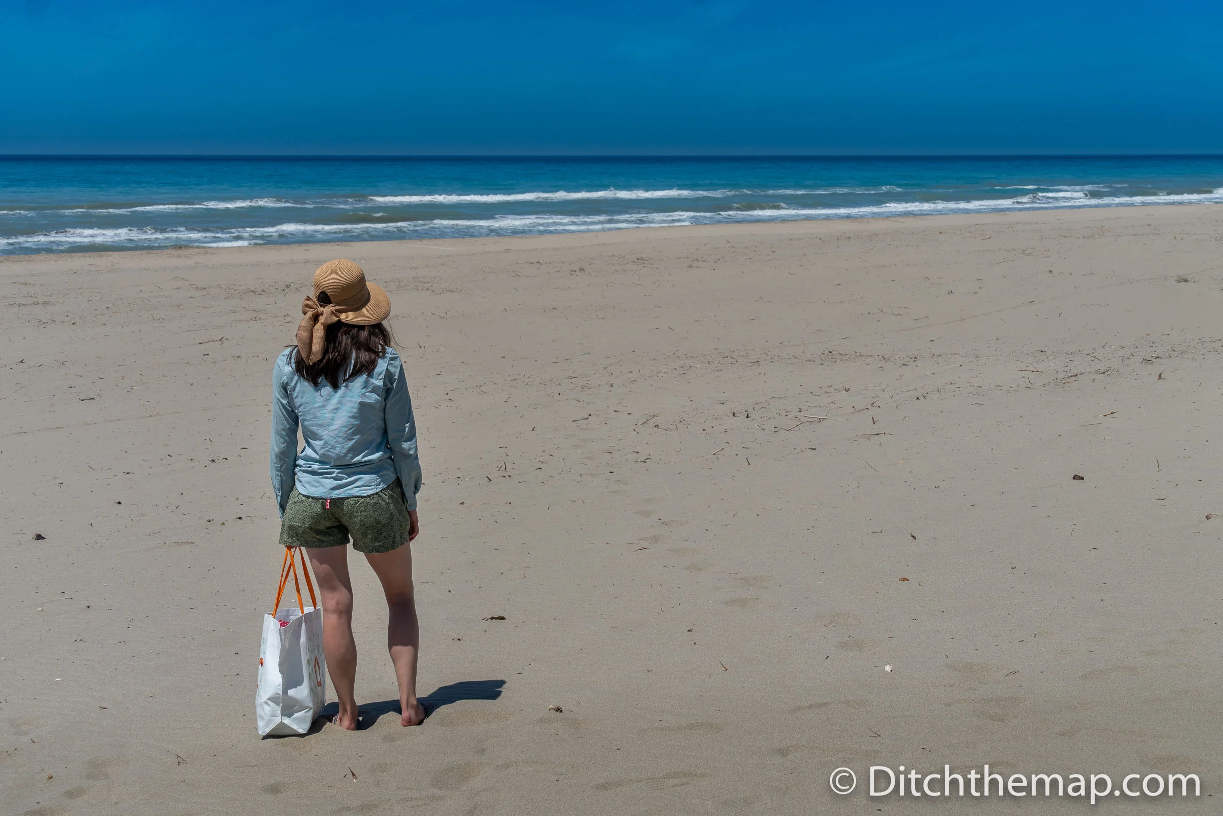 Girl Walking on sandy beach