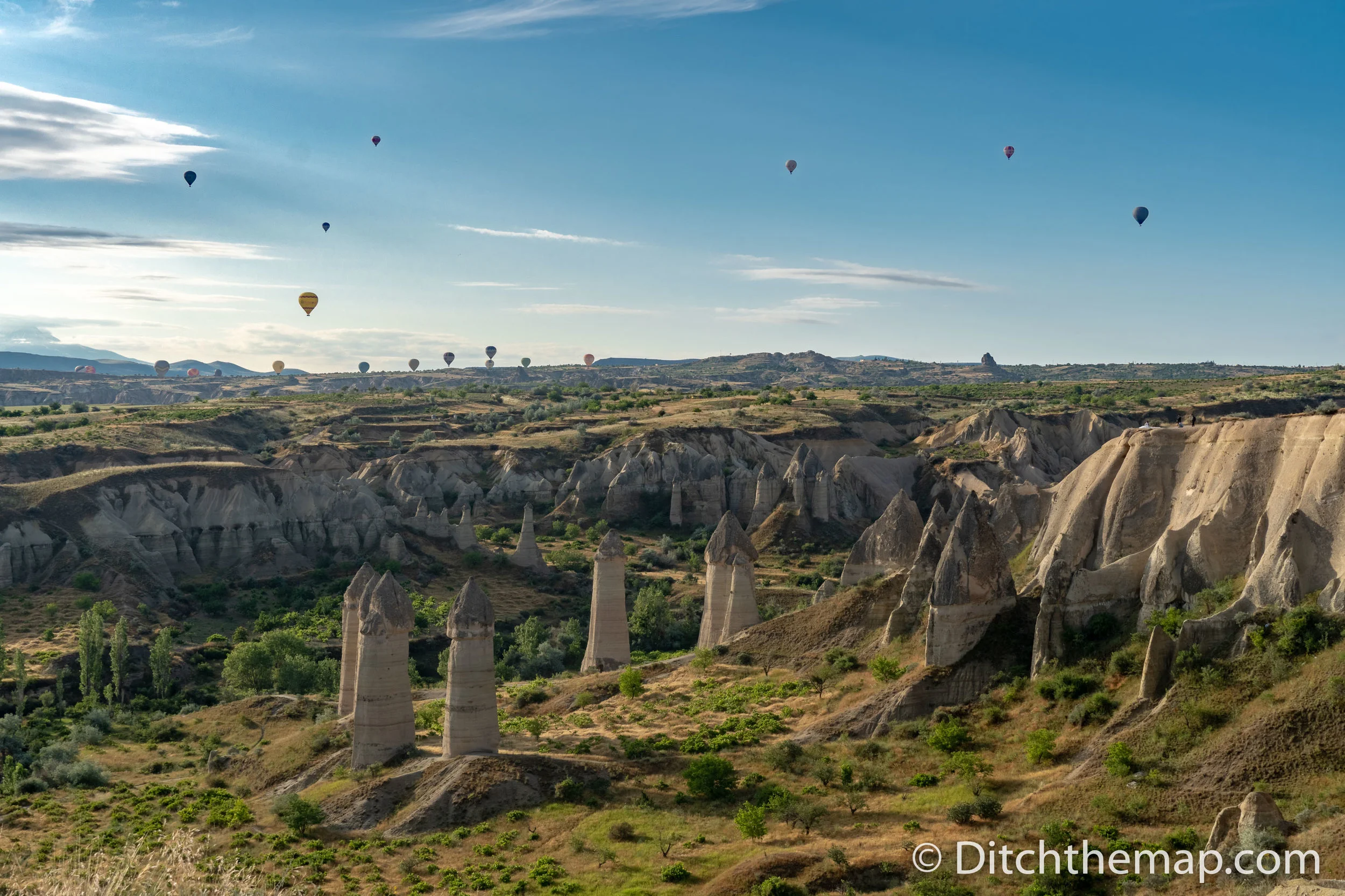 Monuments and balloons in sky