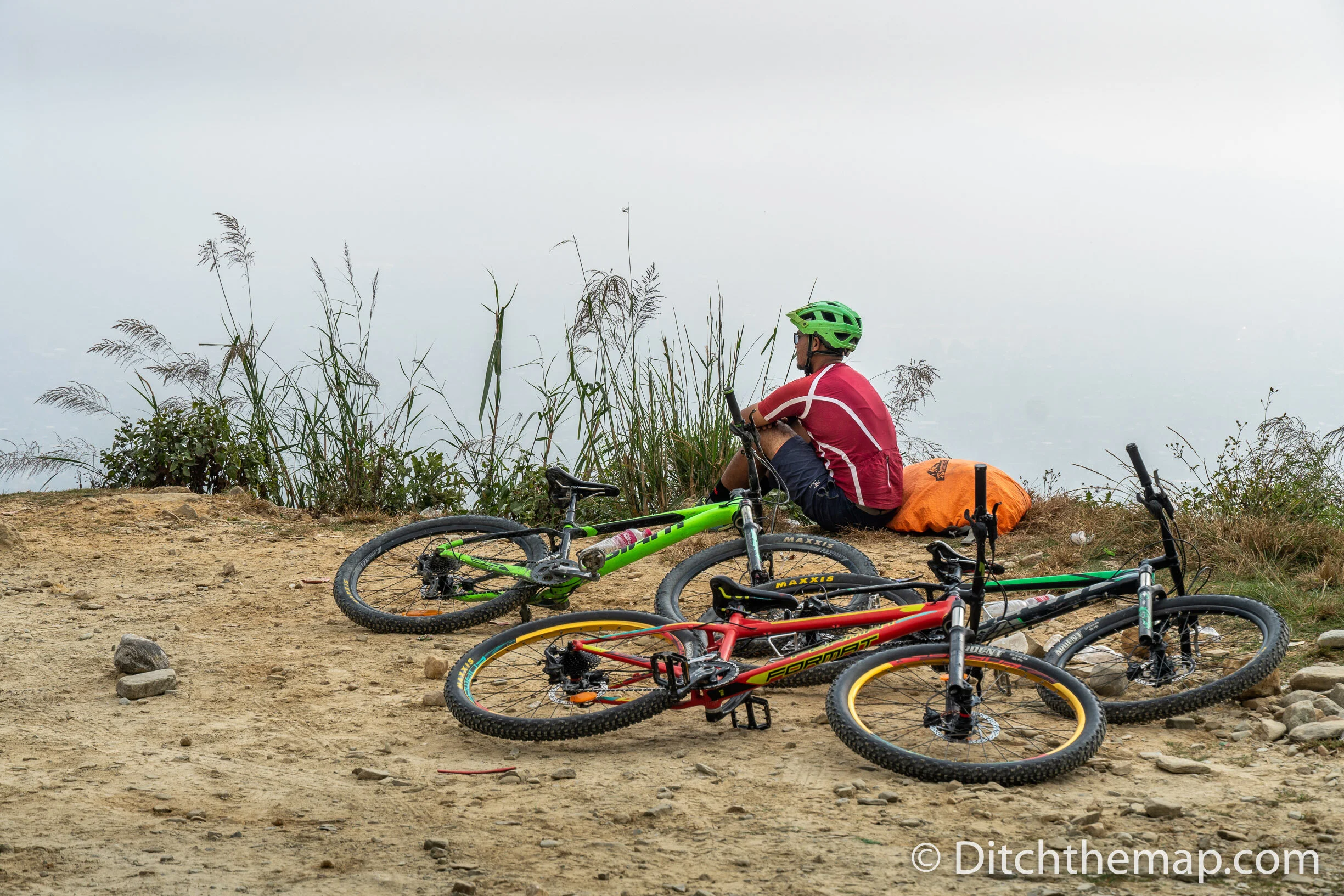 Man Sitting Next to Biked