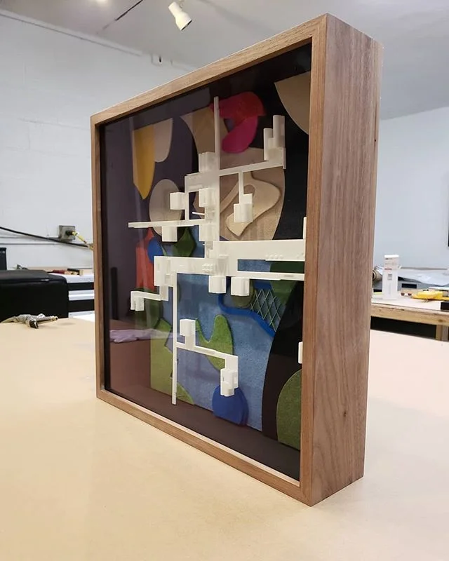 A framed architectural model by Standard Architecture. @standardarchitecture #shadowbox #walnut #picture framing #architecture #addidas