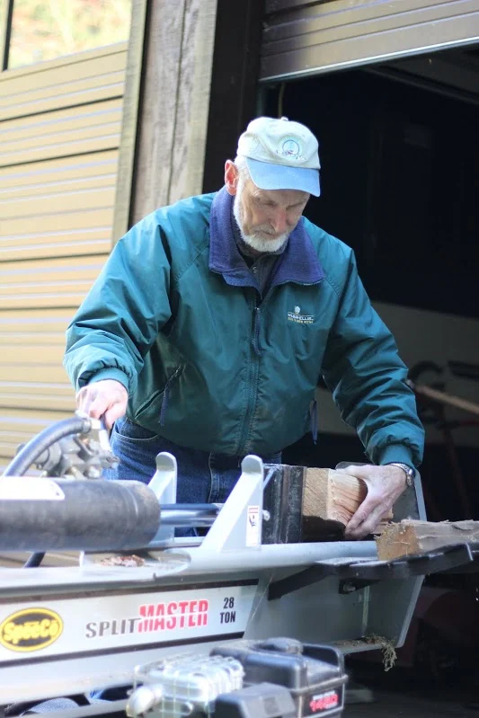 Duane demonstrates his newest machine, a log splitter, which helps him split wood much faster. No more sore muscles!