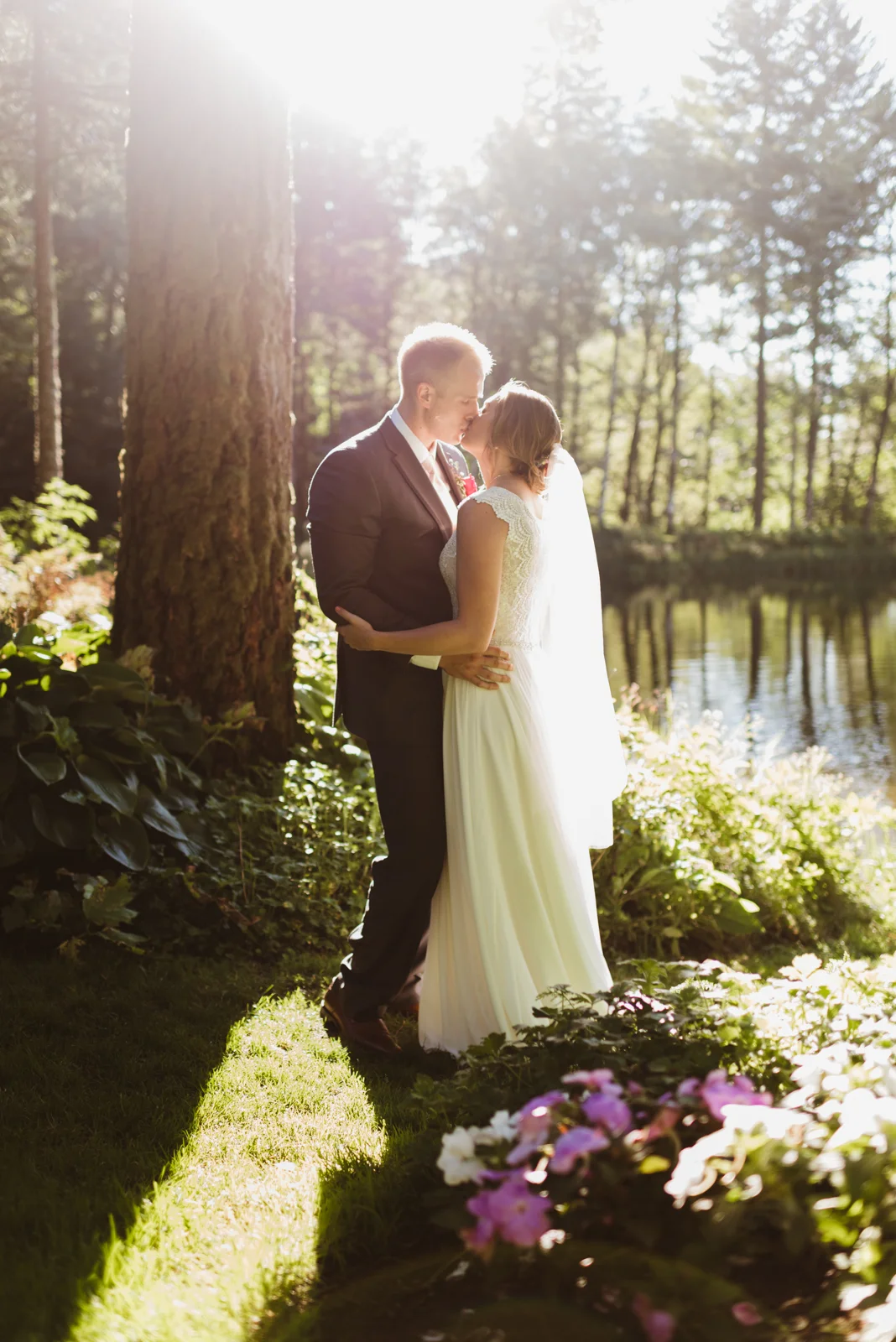 bride and groom portrait by lake