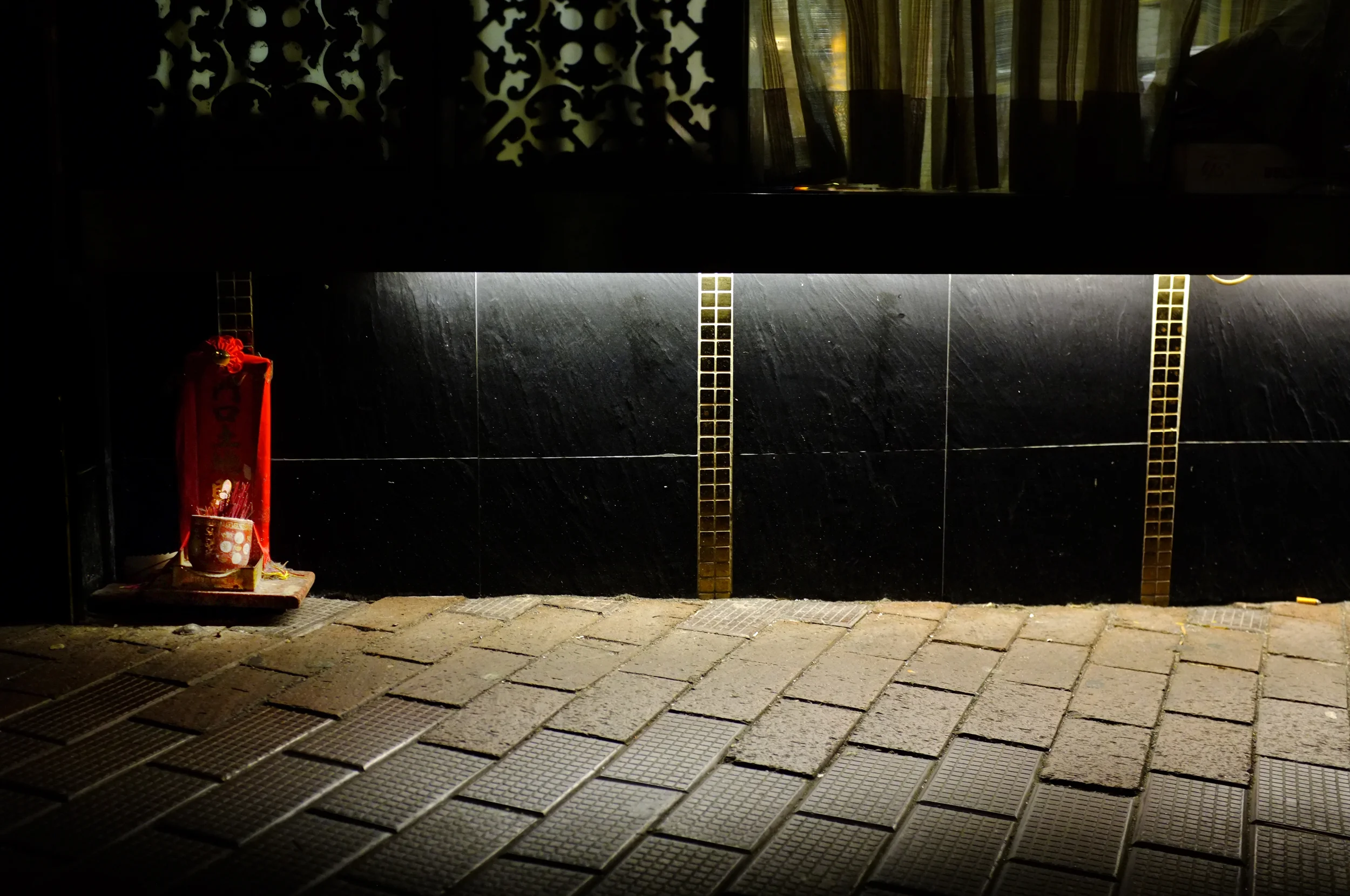 Small shrine next to a restaurant in Aberdeen, Hong Kong Island