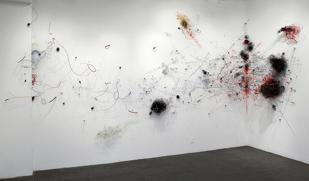 The Naked Kiss, 2009 Monofilament, plastic mesh, vinyl lanyard, plastic beads, pipe cleaners, Dacron line, t-pins Dimensions variable At McKenzie Fine Art, NYC
