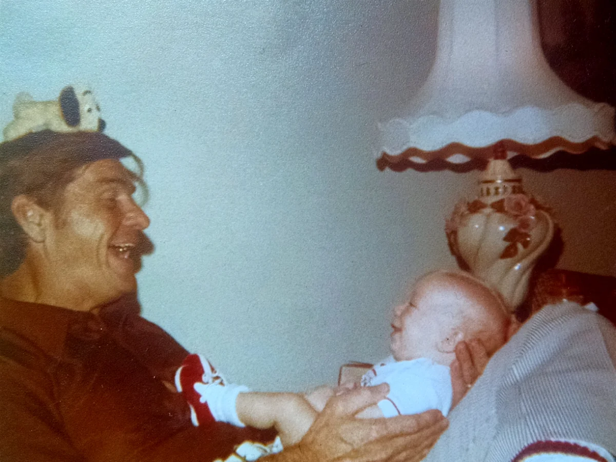Bapa entertaining me with a routine at 4 months old