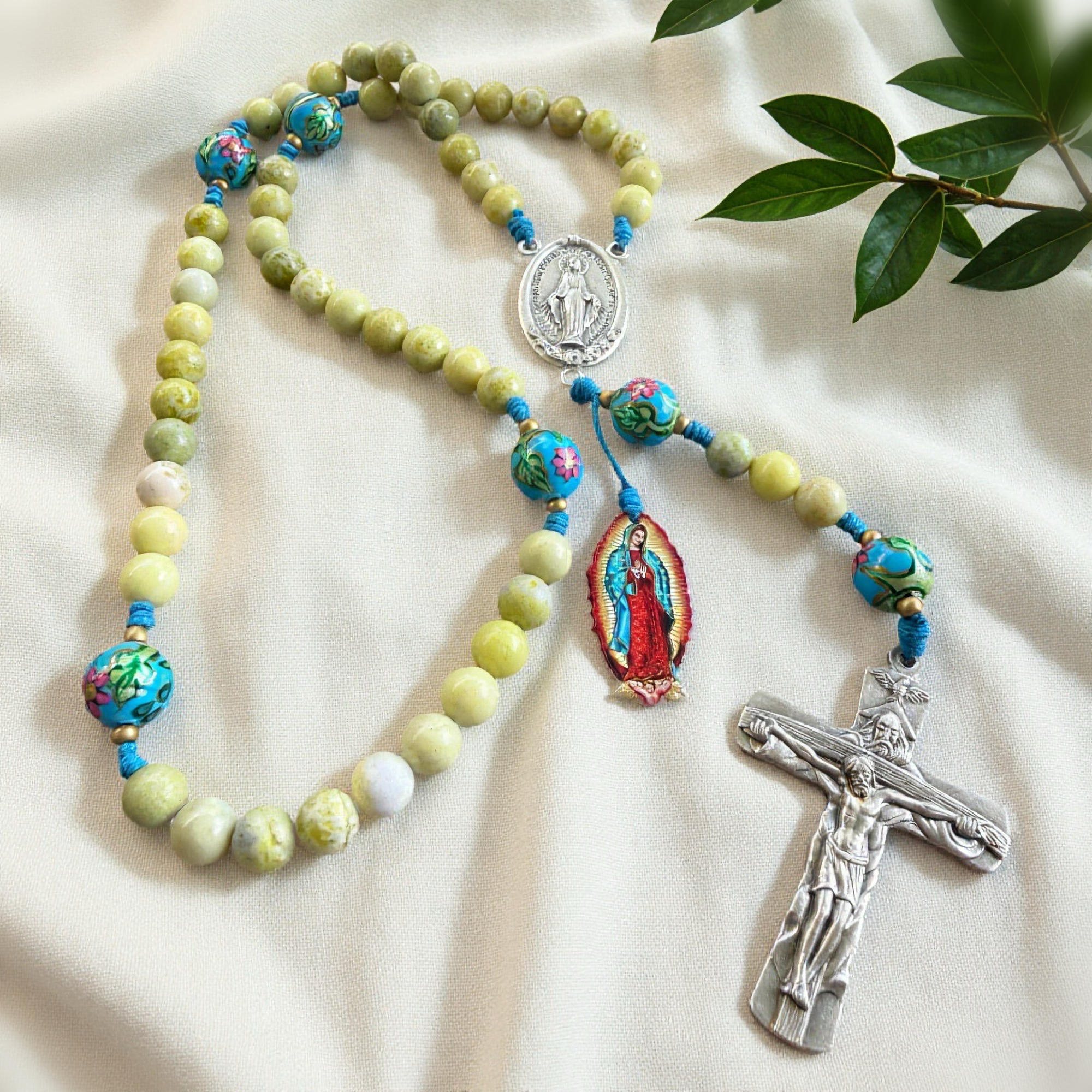 Rosary with Light Green River Stone and Floral Blue Beads: Holy Trinity Crucifix, Miraculous Medal and Our Lady of Guadalupe