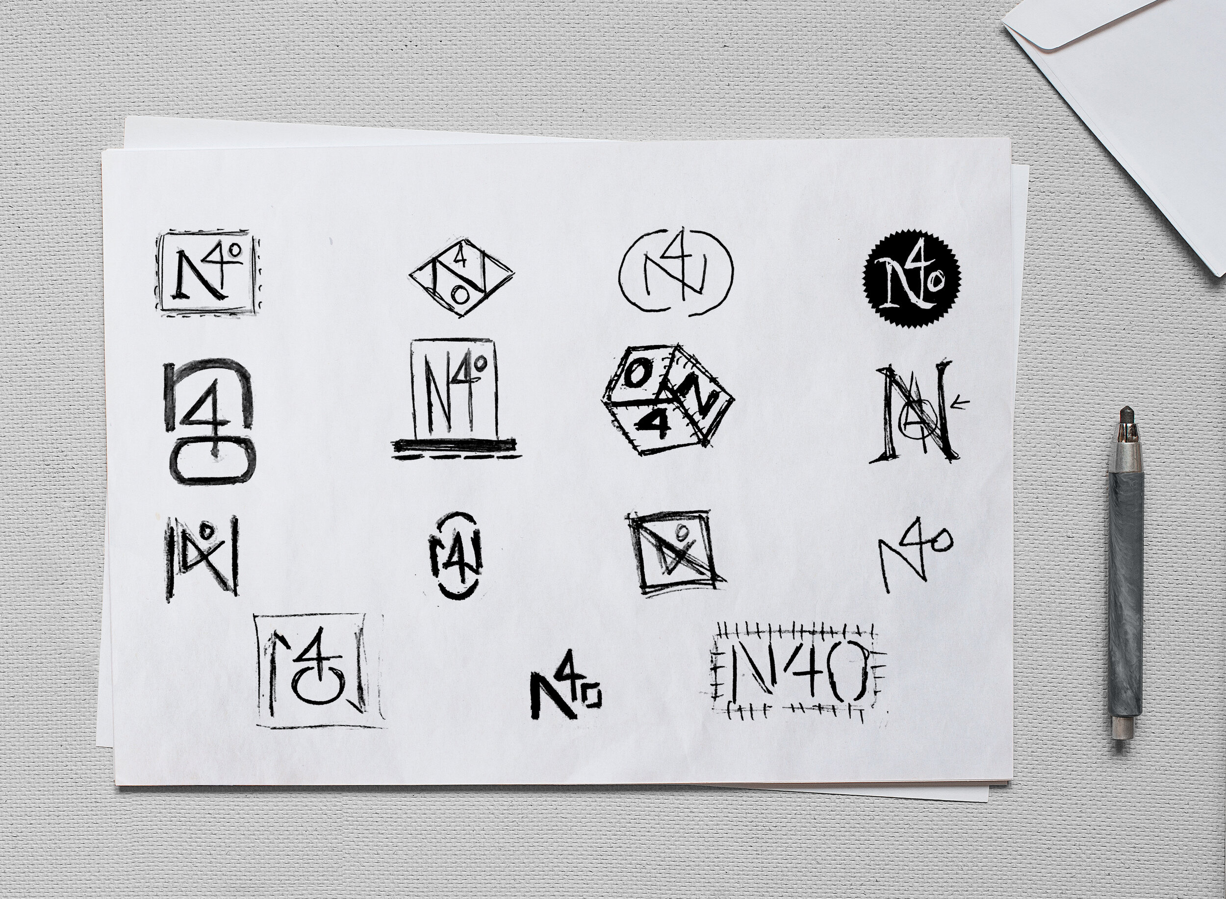 N40 logo sketches on paper mockup.jpg